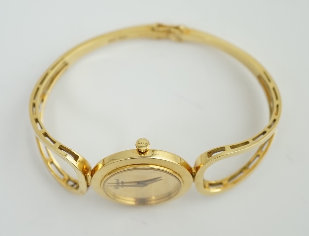 A lady's 18k gold Swiss Chopard manual wind hinged bangle wrist watch